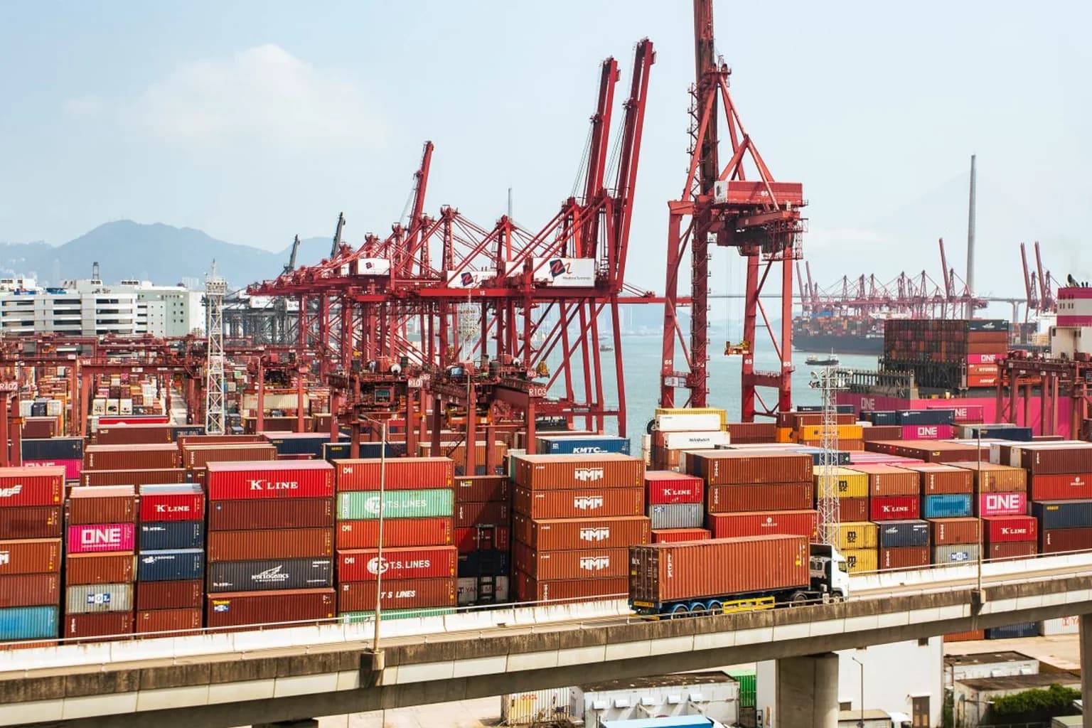 Shipping containers and cranes at a commercial cargo port
