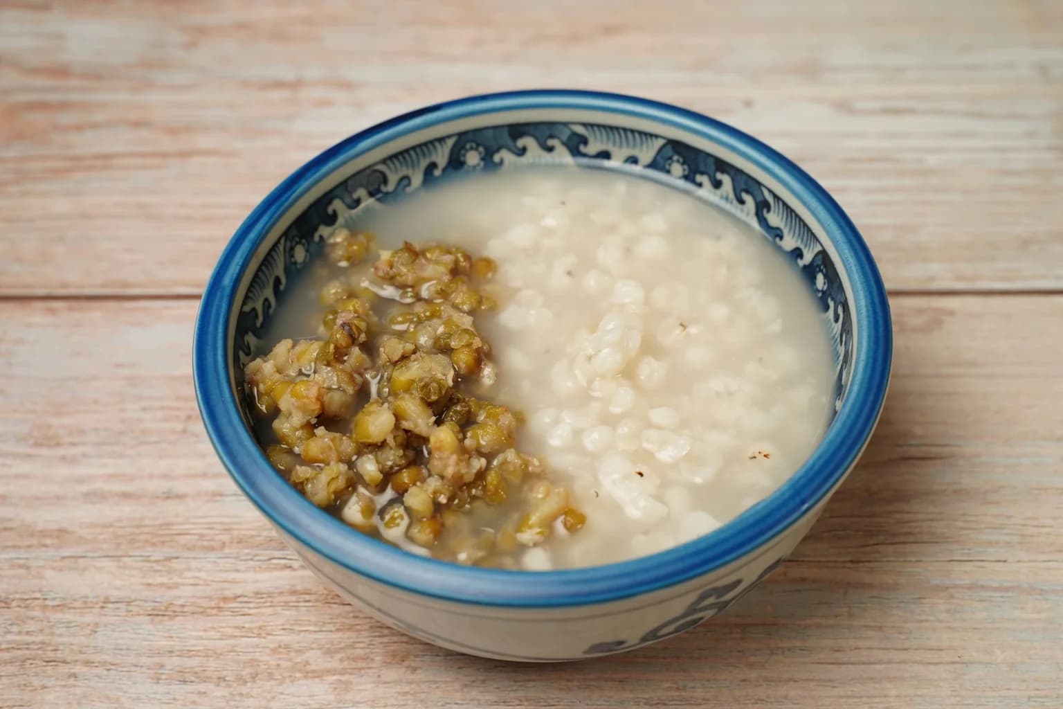 Rice and mung bean porridge served in a ceramic bowl